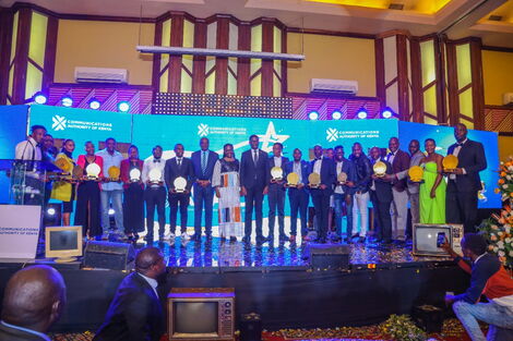 Communications Authority of Kenya Director General Ezra Chiloba with various winners at the 2022 Kuza awards.
