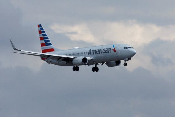 American Airlines said it expected to fly about about 8 to 10 percent fewer passengers in the first three months of this year compared with the same period in 2019.