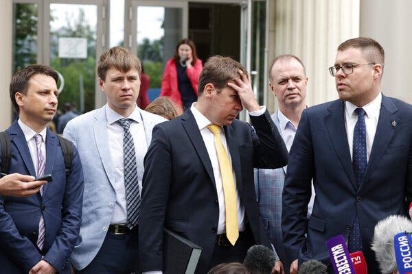 Lawyers for Aleksei Navalny’s Anti-Corruption Foundation leaving court in Moscow, where the group was named as an extremist organization on Wednesday.
