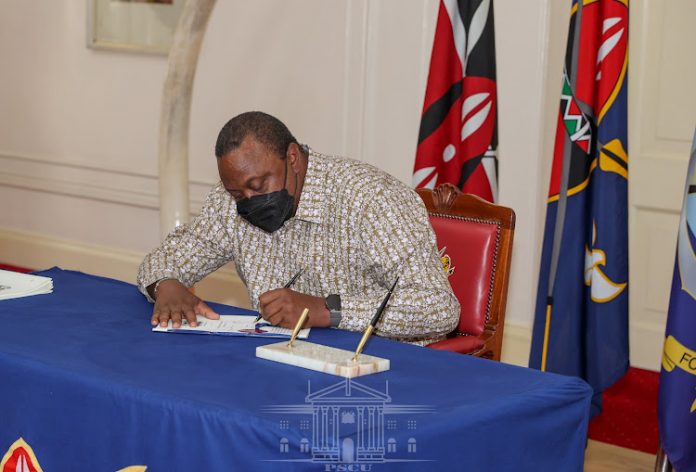 in President Uhuru Kenyatta assents to the Refugees Bill, Foreign Service Bill and the Law of Succession (Amendment) Bill into law at State House, Nairobi on November 17, 2021.