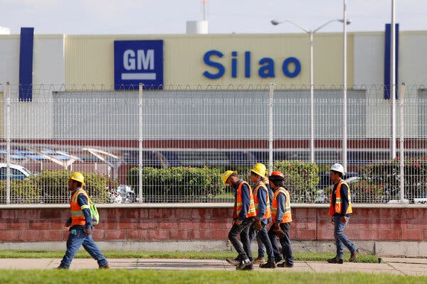Workers leaving a General Motors plant in Silao, Mexico, in 2019.