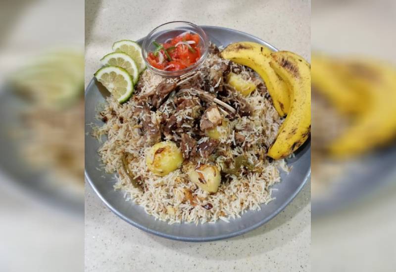 Delicious goat rice ‘pilaf’ Eve woman