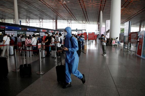 Beijing extends movement curbs to contain resurgent coronavirus