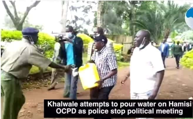 VIDEO: Drama as Khalwale Washes Police Boss With Bucket of Water