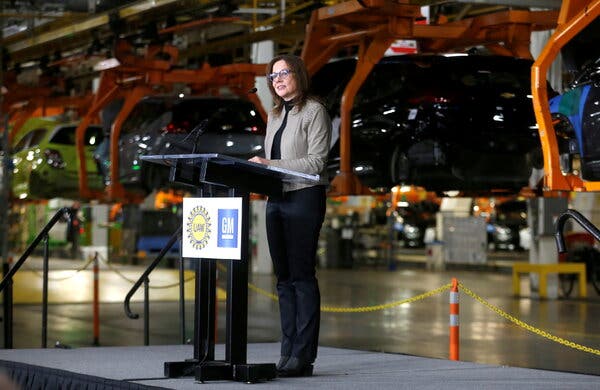 Mary Barra, the chief executive of General Motors, at an assembly plant in Michigan last month. President Biden is seeking to reinstate Obama-era auto pollution restrictions to combat climate change.