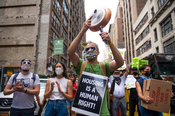 Alex Lee, an organizer of Cooper Square Committee, marches in New York last month with tenants who are behind on rent and facing eviction as pandemic-era protections lapse.