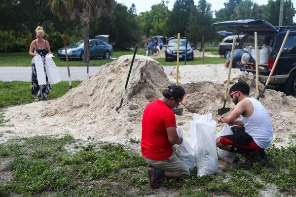 Residents filled sandbags in Seminole, Fla., on Monday before the arrival of Tropical Storm Elsa.