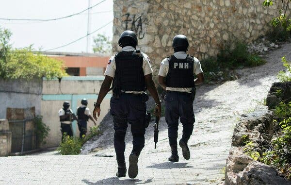 Police officers searched near the Taiwan Embassy in Haiti on Friday after 11 people were arrested on the grounds there.