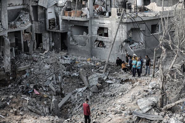 Gaza residents surveying the damage to their homes on Friday.