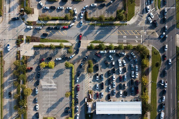 Cars snaked through a Costco parking lot as drivers waited to get gas in New Orleans on Wednesday.