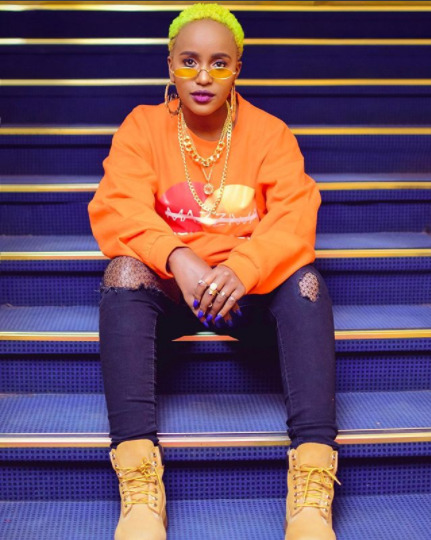 Femi One parades sizzling beach body as she slips into skimpy bikini (Photos)