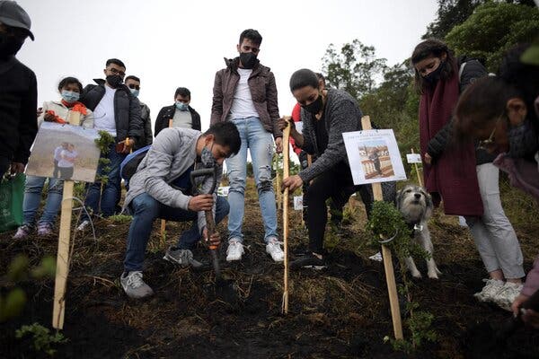 Relatives spreading the ashes of family members who died from Covid-19, at the nature reserve of Páramo de Guerrero in Cogua municipality, Colombia, on Monday.