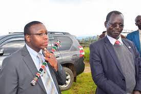 West Pokot Governor John Lonyangapuo (right) and his Deputy, Nicholas Atudonyang, during the issuance of 1,654 title deeds in Kapsait in December 2017.