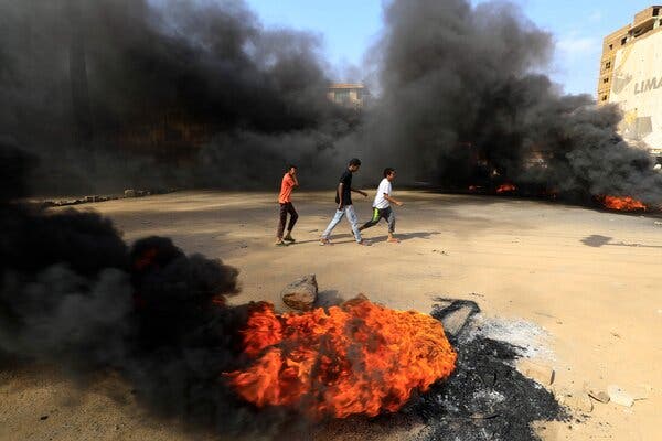 Protesters burning tires in Khartoum, Sudan, after the military detained civilian leaders on Monday.