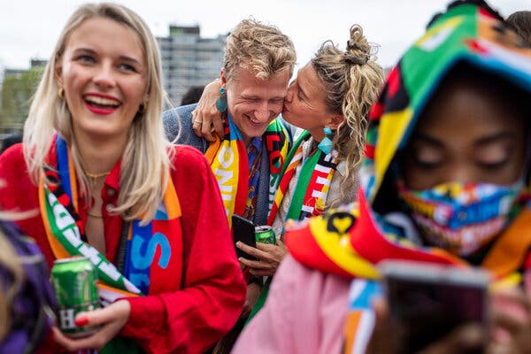 Eurovision fans waiting in the rain to enter the Ahoy Arena before the final on Saturday in Rotterdam.