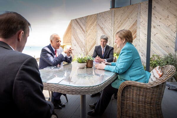 President Biden with Chancellor Angela Merkel of Germany on Saturday in St. Ives, England.