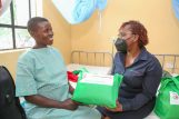 Karen Basiye(right), H.O.D Sustainable Business & Social Impact handing over a Mama pack to Eunice Auma(right). This is an incentive to encourage expectant mothers to choose hospitals as their safe delivery institutions as opposed to homes. The event was held at Ndhiwa Sub County Hospital Homabay County. The event was held at Ndhiwa Sub County Hospital Homabay County - Bizna Kenya