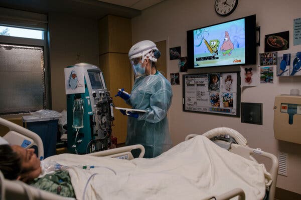 Masha Crawford, a nurse, tends to a patient on dialysis at Providence St. John’s Health Center in Los Angeles. People hospitalized with Covid-19 are at greater risk of kidney damage, a new study finds.