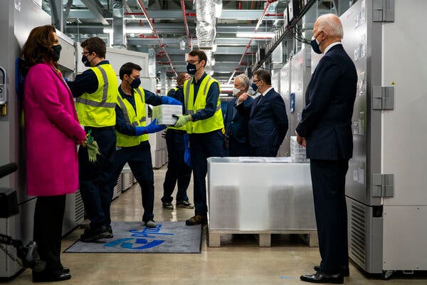 President Biden watched as vaccines were loaded into cold storage during a tour of the Pfizer Kalamazoo Manufacturing Site in Michigan in February.