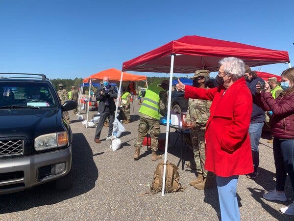 Gov. Kay Ivey of Alabama giving a thumbs up to people in line to get Covid-19 vaccinations at a National Guard clinic in April.