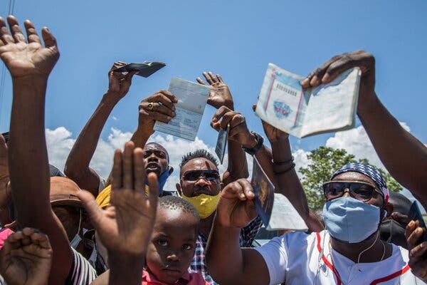 Haitian citizens outside the U.S. Embassy in Haiti on Saturday.