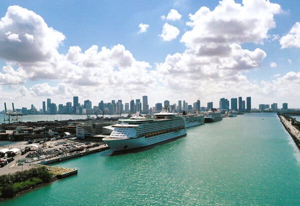 Explorer of the Seas (front), a Royal Caribbean cruise ship, along with other cruise ships in Miami, late May. It’s unclear if cruise lines will be able to sail out of cities in Florida.