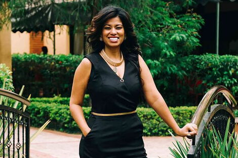 Media personality Julie Gichuru poses for a photo.