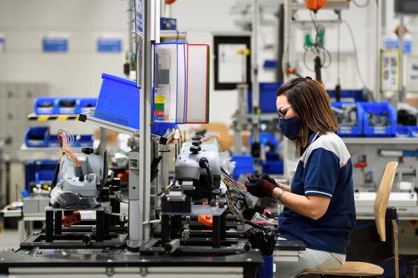 A worker at MTA, a maker of electronic components, in Codogno, Italy. Eurozone manufacturers have been reporting new orders.