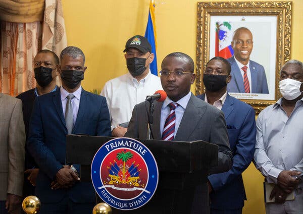 Claude Joseph, center, the interim prime minister, has essentially put Haiti under martial law, but constitutional experts questioned his right to impose it.