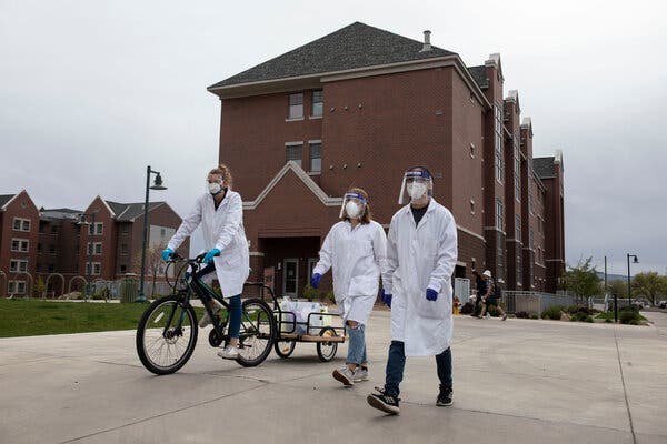 Engineering students at Colorado Mesa University collect wastewater samples to test for Covid-19 around campus. They meet three times a week to do the sampling rounds, where they rides bikes carrying carts of their testing gear.