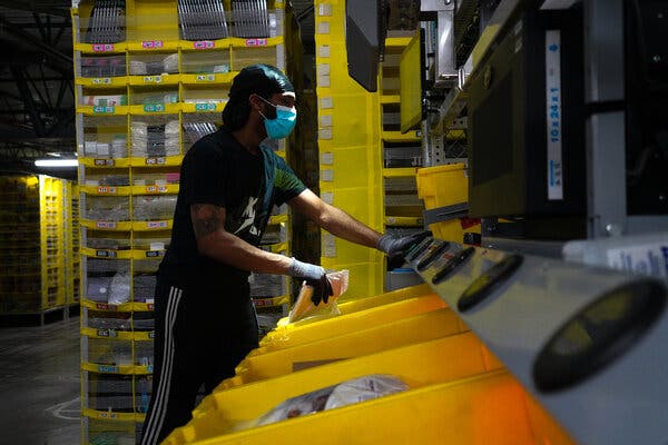 An employee sorted items at a Staten Island warehouse in May. Workers have complained that supervisors push them to work at speeds that wear them down.