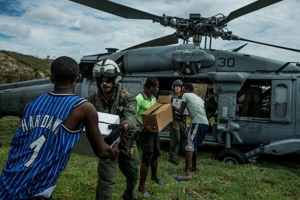 U.S. soldiers delivering aid from the World Food Program to Jabouin, Haiti, after Hurricane Matthew destroyed dozens of villages in 2016.
