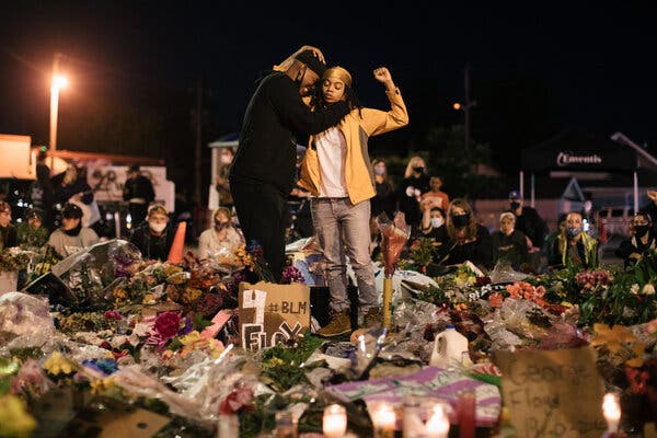 People gathered at a memorial in Minneapolis days after George Floyd was killed by the police last May.