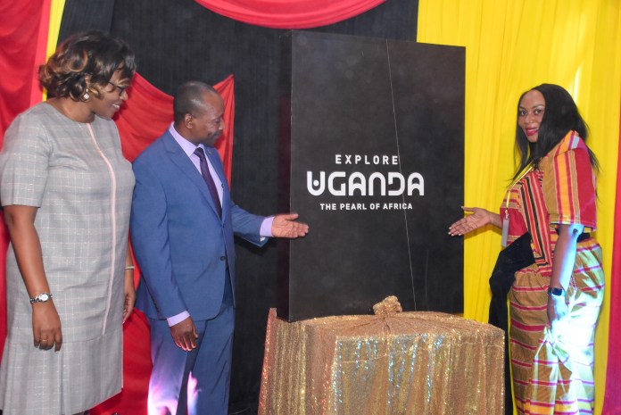 (L-R) Uganda Airlines Country Manager- Kenya Peggy Macharia, His Excellency Aryabaha P. Evans, Deputy High Commissioner of Uganda to Kenya and Uganda Tourism Board Marketing Manager Claire Mugabi unveil the new Uganda Tourism Brand during a Kenyan roadshow aimed at boosting cross-border tourism between the two East African Countries - Bizna Kenya