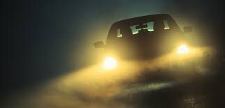 shot of a car driving through the night