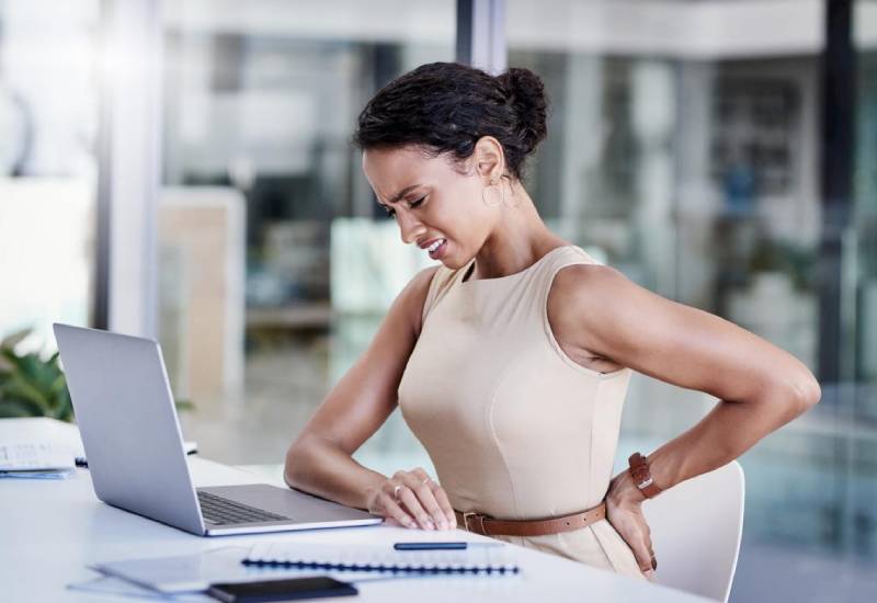 How to manage lower back pain Eve woman