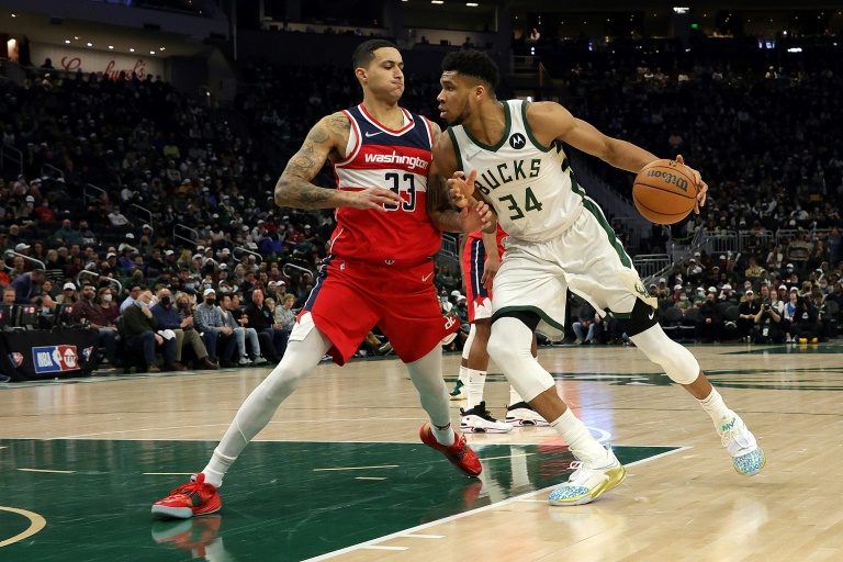 Giannis' triple double helps topple struggling Wizards