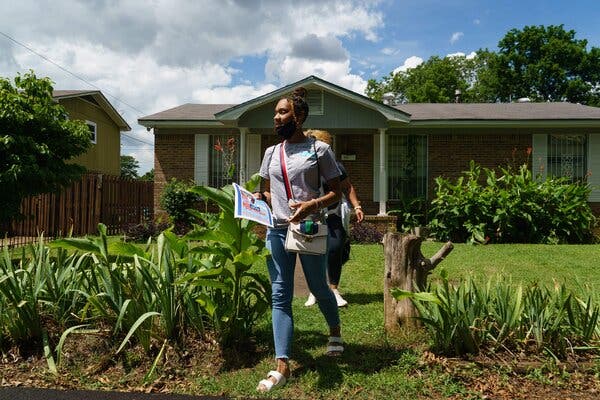 Volunteers walked door to door last week, during an outreach campaign to inform residents of an upcoming coronavirus vaccination event in Birmingham, Ala.