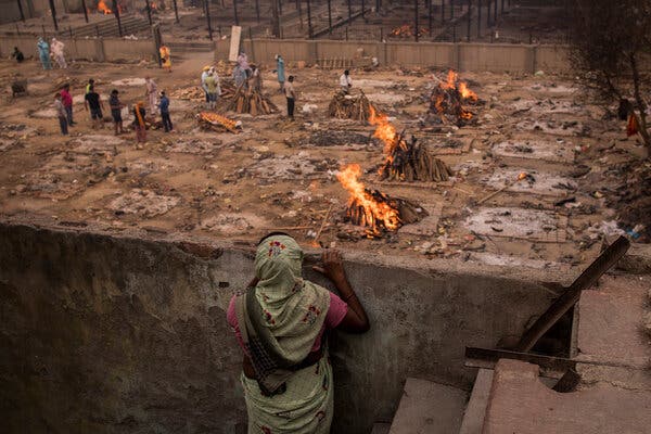 Funeral pyres of coronavirus victims at a makeshift crematorium in New Delhi on Sunday.