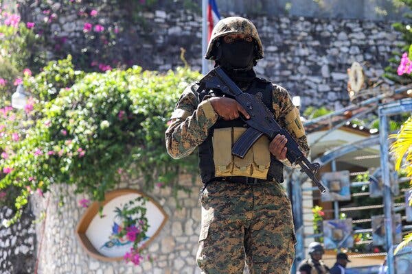 A police officer standing guard outside the presidential residence in Port-au-Prince on Wednesday.