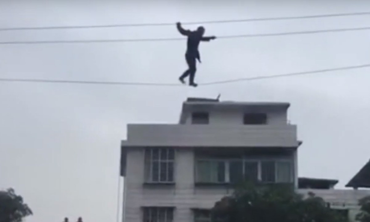 KETRACO Technician Riskily Walks Along a Power Line to Fix Blackout (Video)